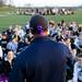 Saline head coach Brian Boze talks to the team with a purple ribbon tied to his hat on Tuesday, April 30. Daniel Brenner I AnnArbor.com